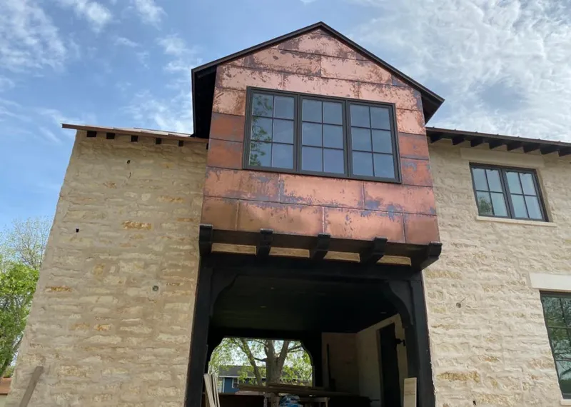Copper metal panel facade on a stone building for Skylight Installation in Boca Raton