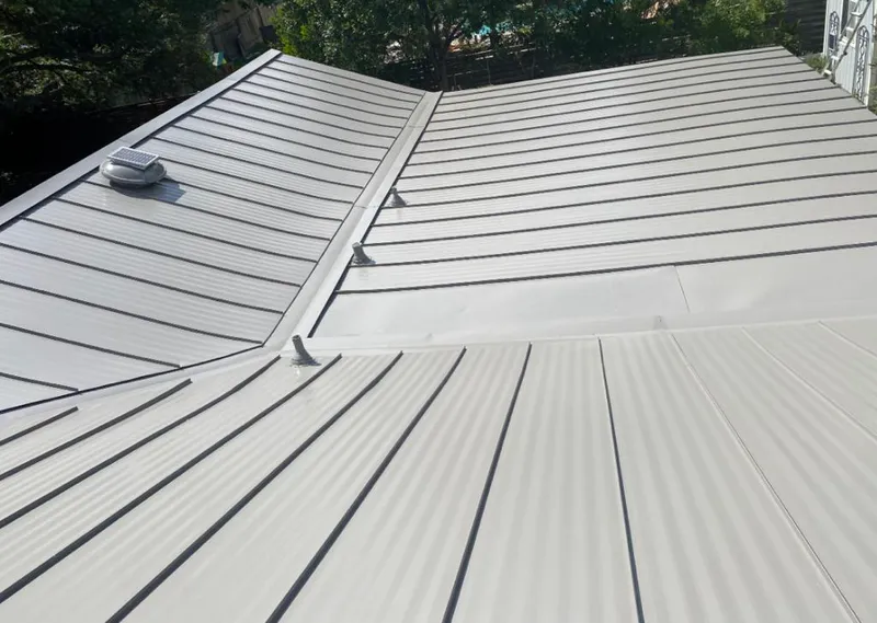 Solar attic fan installed on a metal roof for Roof Ventilation in Boca Raton