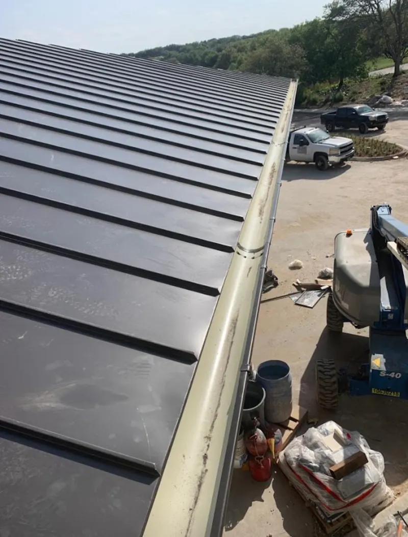 Standing seam panel and gutter detail on a metal roofing jobsite in Boca Raton